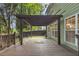 Spacious wood patio with pergola and stone outdoor area perfect for entertaining at 335 Pintail Ct, Suwanee, GA 30024