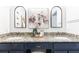 Bathroom with dual sinks, framed mirrors, granite countertops, and a modern design at 535 Silver Pine Trl, Roswell, GA 30076