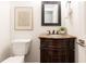 Charming bathroom with dark wood vanity, marble countertop, and modern fixtures at 535 Silver Pine Trl, Roswell, GA 30076
