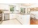 Bright kitchen with stainless steel appliances, white cabinetry, and granite countertops at 535 Silver Pine Trl, Roswell, GA 30076