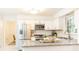 Updated kitchen with stainless steel appliances, granite countertops, and white cabinets at 535 Silver Pine Trl, Roswell, GA 30076