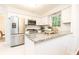 Modern kitchen with stainless steel appliances, white cabinets, and granite countertops at 535 Silver Pine Trl, Roswell, GA 30076