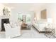 Bright, neutral living room with fireplace, plush seating, and natural light from large windows at 535 Silver Pine Trl, Roswell, GA 30076