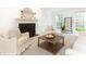Bright living room featuring a fireplace, plush seating, and natural light at 535 Silver Pine Trl, Roswell, GA 30076
