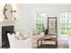 Bright living room featuring a fireplace, plush seating, and natural light at 535 Silver Pine Trl, Roswell, GA 30076