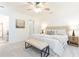Spacious main bedroom featuring soft carpet, neutral tones, and a ceiling fan at 535 Silver Pine Trl, Roswell, GA 30076