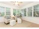 Cozy sunroom featuring neutral furniture and an abundance of natural light at 535 Silver Pine Trl, Roswell, GA 30076