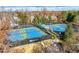 Community tennis courts featuring well-maintained surfaces and a covered shelter, offering an active lifestyle at 4615 Kilmersdon Ln, Suwanee, GA 30024
