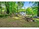 A spacious backyard features a firepit area and lots of trees, creating a private setting at 4882 Rock Haven Sw Dr, Lilburn, GA 30047