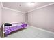 Finished basement bedroom featuring a twin bed, tile flooring and painted neutral walls at 4882 Rock Haven Sw Dr, Lilburn, GA 30047