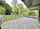 Spacious outdoor deck with unique chevron-patterned flooring and black metal railings, perfect for entertaining at 4882 Rock Haven Sw Dr, Lilburn, GA 30047