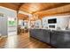 Inviting living room boasts hardwood floors, vaulted wood ceilings, a cozy fireplace, and ample natural light at 4882 Rock Haven Sw Dr, Lilburn, GA 30047