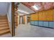The unfinished basement features exposed ceilings, painted walls, and concrete flooring at 116 Laurel Ln, Social Circle, GA 30025