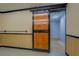 Unique basement showcases a rustic sliding door, providing functional separation with an eye-catching design feature at 116 Laurel Ln, Social Circle, GA 30025