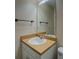 Cozy bathroom features a white sink, neutral countertop and ample lighting from the mirror reflecting the space at 116 Laurel Ln, Social Circle, GA 30025