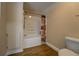 Clean bathroom featuring a shower and bathtub combo, a toilet, and clean walls at 116 Laurel Ln, Social Circle, GA 30025