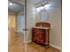 Bathroom vanity with hardwood floors and a decorative light fixture at 116 Laurel Ln, Social Circle, GA 30025