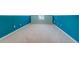 Bedroom features blue accent walls and large window at 116 Laurel Ln, Social Circle, GA 30025