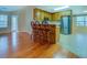 Open concept kitchen featuring wood cabinets, stainless steel appliances, and a breakfast bar with seating at 116 Laurel Ln, Social Circle, GA 30025