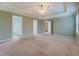 Large main bedroom featuring ensuite bath and walk-in closets at 116 Laurel Ln, Social Circle, GA 30025