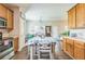 Bright dining area features wood floors, modern lighting, and easy access to the kitchen at 152 Ridge Xing, Temple, GA 30179