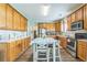 Eat-in kitchen featuring wood cabinets, stainless steel appliances, and durable flooring at 152 Ridge Xing, Temple, GA 30179