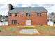 Exterior of the brick home with a large backyard, patio, and white fence at 362 Interlake Pass, Mcdonough, GA 30252