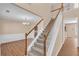 Bright and spacious foyer with a staircase leading to the second floor and hardwood floors at 362 Interlake Pass, Mcdonough, GA 30252