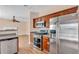 Modern kitchen featuring stainless steel appliances, wood cabinets, and granite countertops at 362 Interlake Pass, Mcdonough, GA 30252