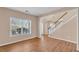 Living room showcasing hardwood floors, natural light from large windows, and neutral paint at 362 Interlake Pass, Mcdonough, GA 30252