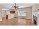 Open concept living room with fireplace, hardwood floors, and lots of natural light at 362 Interlake Pass, Mcdonough, GA 30252