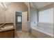 Bathroom vanity and bathtub with natural light at 4139 Kensington Cv, Atlanta, GA 30349