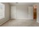 Neutral bedroom with carpet, natural light, and two doors at 4139 Kensington Cv, Atlanta, GA 30349