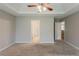 Bedroom with carpet and open doors leading to other rooms at 4139 Kensington Cv, Atlanta, GA 30349