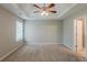 Bright bedroom with a ceiling fan, neutral walls, and carpeted floor at 4139 Kensington Cv, Atlanta, GA 30349