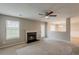 Inviting living room with fireplace and ceiling fan at 4139 Kensington Cv, Atlanta, GA 30349