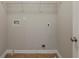 Bright room with neutral walls, tile flooring, and overhead storage rack system at 4139 Kensington Cv, Atlanta, GA 30349
