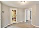 Entryway featuring wood-look floors, neutral colored walls, and full view glass door to the back yard at 415 Collegiate Dr, Powder Springs, GA 30127