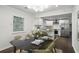 Stylish dining area adjacent to a modern kitchen with white cabinets and stainless steel appliances at 360 New Jersey Nw Ave, Atlanta, GA 30314