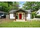 Charming home featuring a bright red front door, contrasting trim, and inviting stone walkway at 360 New Jersey Nw Ave, Atlanta, GA 30314