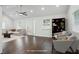 Bright living room with hardwood floors, plush seating, and a view into the dining area at 360 New Jersey Nw Ave, Atlanta, GA 30314