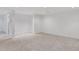 Spacious finished basement with neutral walls and carpet, perfect for recreation at 1020 Riverside Rd, Roswell, GA 30076