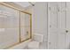 Bathroom featuring a gold trimmed shower/tub and a toilet at 1020 Riverside Rd, Roswell, GA 30076