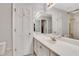 Bathroom featuring shower/tub, white cabinets, and large mirror at 1020 Riverside Rd, Roswell, GA 30076