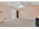 Spacious carpeted bedroom with ceiling fan, neutral walls, and ample natural light at 1020 Riverside Rd, Roswell, GA 30076