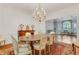 Formal dining room with chandelier, hardwood floor, and view to living room at 1020 Riverside Rd, Roswell, GA 30076