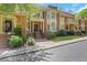 Beautiful brick townhome with a bay window and manicured landscaping at 1020 Riverside Rd, Roswell, GA 30076
