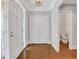 Bright foyer with hardwood floors and access to a half bath at 1020 Riverside Rd, Roswell, GA 30076