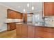 A well-equipped kitchen featuring stainless steel appliances, wood cabinetry and an island at 1020 Riverside Rd, Roswell, GA 30076