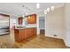 A kitchen with stainless steel appliances and wood cabinets, with a dining area at 1020 Riverside Rd, Roswell, GA 30076
